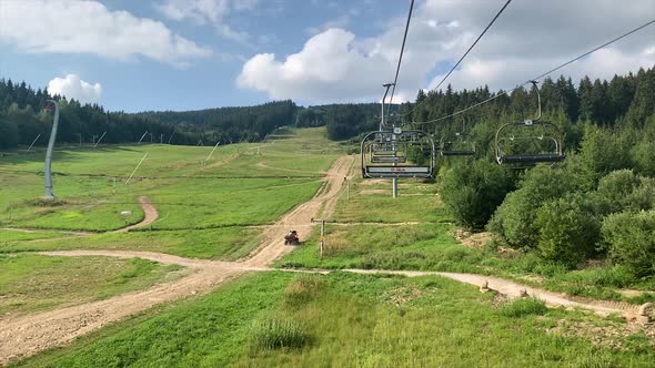 empty Ski lift cable way in the summer sunny day with view up the mountain