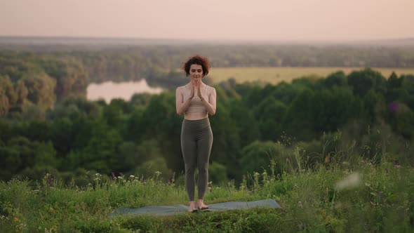 Woman Doing Yoga In Hawaii Mountains Meditating