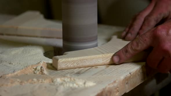 Carpenter Polishing Wood with Sander