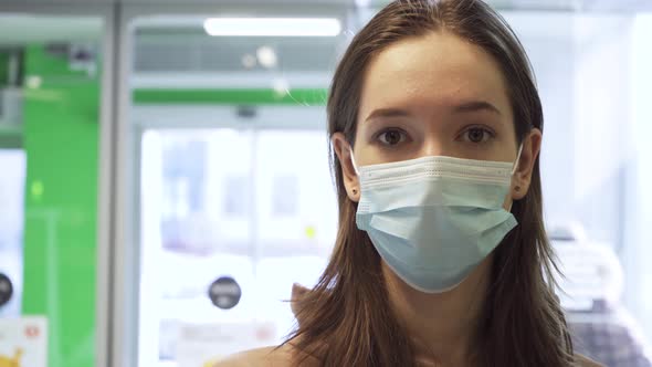 Young Woman in Medical Mask at the Supermarket