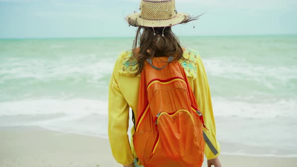 Woman in Summer Bright Clothes with Open Arms Standing in Front Beautiful Seascape View Enjoying