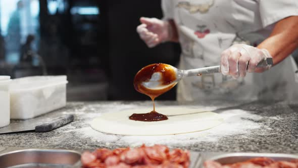 Chef Cook Cooking Cooking Street Food Red Sauce Spread On Dough Spreading Pizza Dough With Red Chili