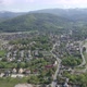 Flying above small city under Mountains  - VideoHive Item for Sale
