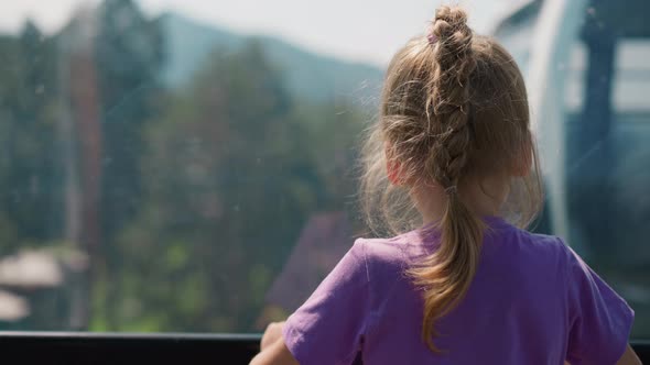 Curious Little Girl Enjoys Fantastic Highland From Ropeway