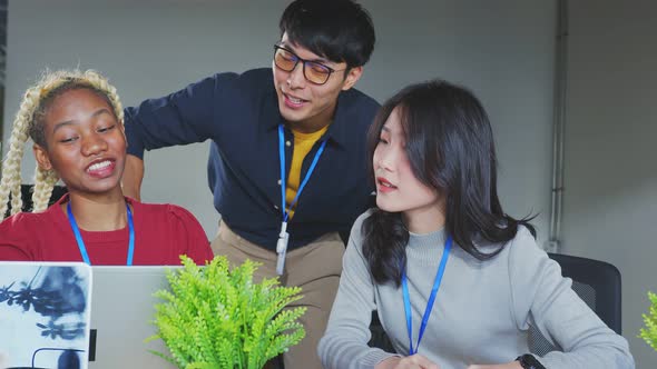 Asian staff creative senior designer coworkers consulting in office