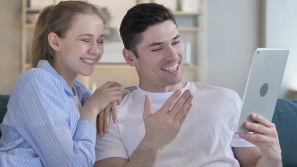 Online Video Chat on Tablet By Young Couple