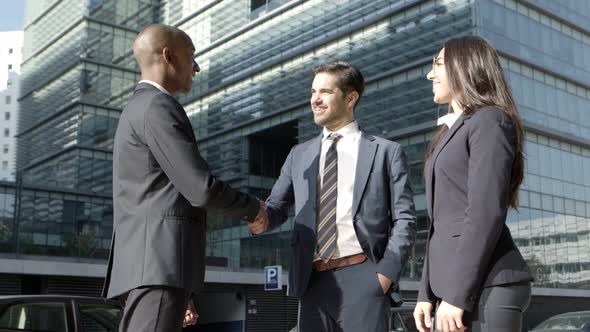 Multiethnic Business Colleagues Meeting on Street