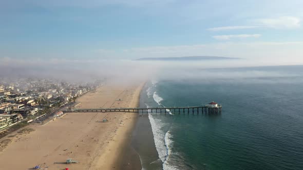 Manhattan Beach Pier On A Cloudy Day In California, USA - aerial drone shot