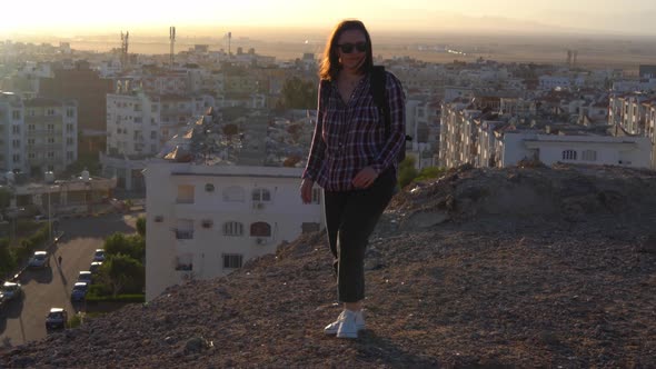 Woman Looking at the Sunrise Ower the Hurghada City