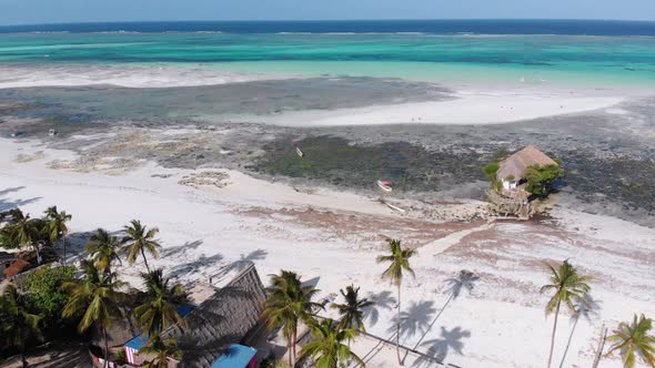 The Rock Restaurant in Ocean Built on Stone at Low Tide on Zanzibar Aerial View