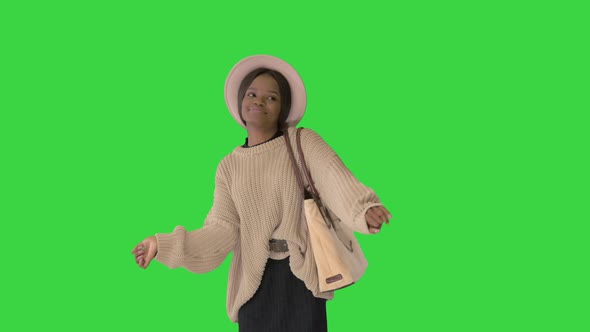 Stylish African American Pretty Young Woman Dancing on a Green Screen, Chroma Key