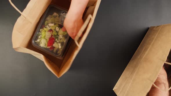 Taking Food Delivery in Disposable Containers From Paper Bags Top View Take Away Meals Catering