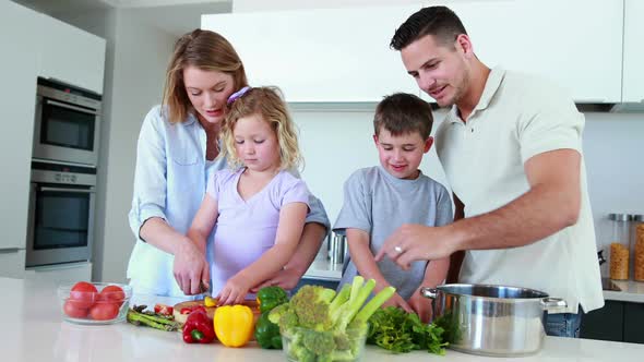 Smiling Family Preparing a Healthy Dinner Together