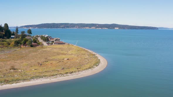 Curved White Sand Beach Seagull Flying Aerial Above View   Camano Island Washington Sunny Waterfront