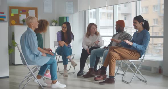 Diverse People Talking and Helping Each Other in Therapy Session or Support Group Meeting