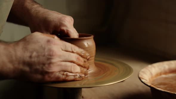 Artist Sculpting Clay Product in Pottery