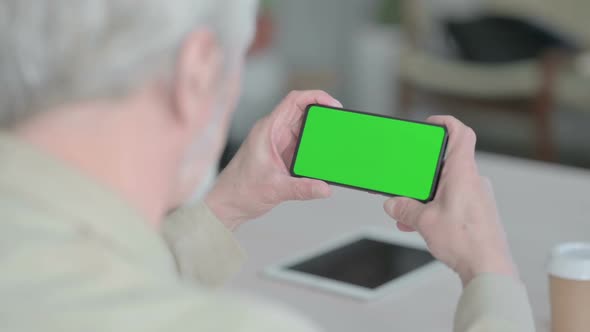 Old Man Watching Smartphone with Chroma Screen