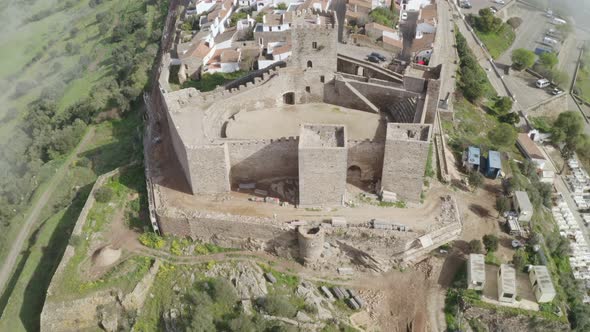 Aerial drone view of Monsaraz on the clouds in Alentejo, Portugal