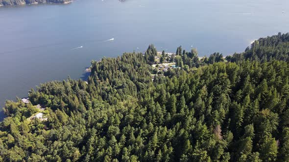 Vibrant and picturesque Soames Hill by the Gibsons ocean coastline in Canada. High angle aerial shot