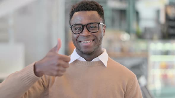 Creative African Man Showing Thumbs Up Sign