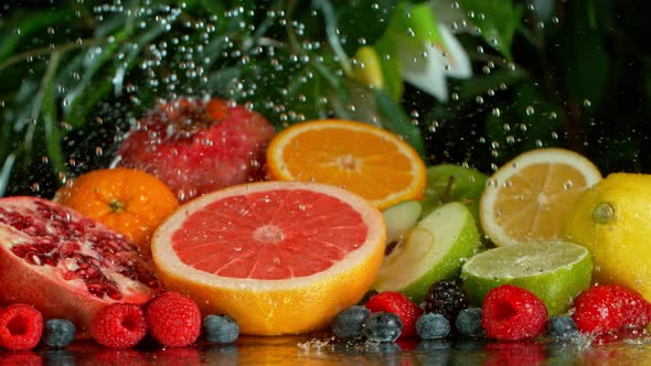 Super Slow Motion Shot of Pouring Water on Variation of Fruits at 1000Fps