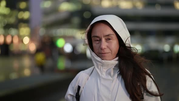 Portrait of Female Passerby on City Street in Evening Charming Middleaged Lady