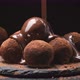 Chocolate Pouring on Truffles Melted Chocolate Icing on Black Slate - VideoHive Item for Sale