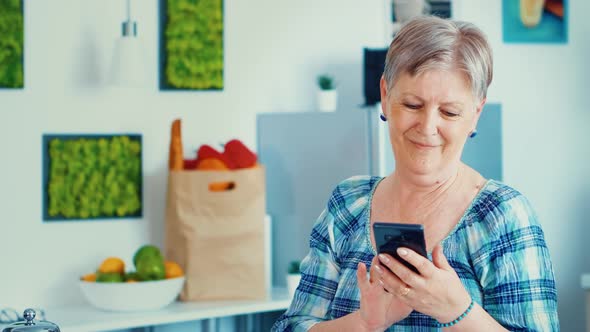 Elderly Woman Browsing on Phone