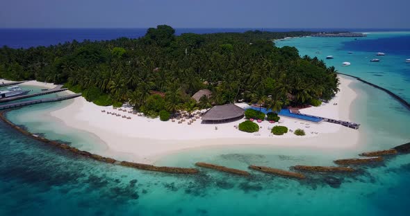 Natural overhead abstract shot of a white sand paradise beach and blue ocean background in high reso