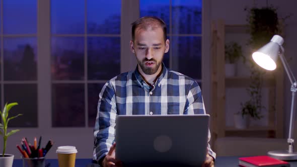 Caucasian Entrepreneur Talking During a Video Call on His Laptop