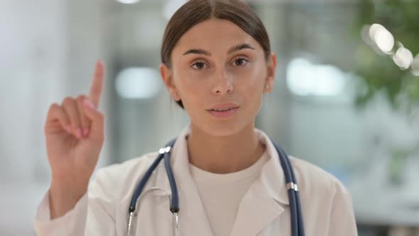 Portrait of Female Doctor Showing No Sign 