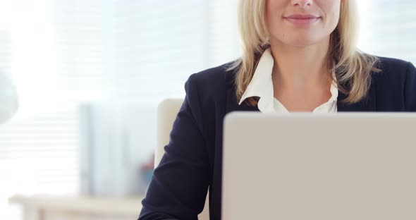 Businesswoman working on laptop