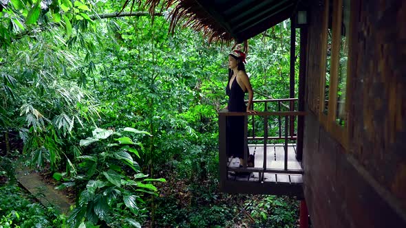 Cute Asian Girl Chilling in Front of a Treehouse in Slow Motion Thailand