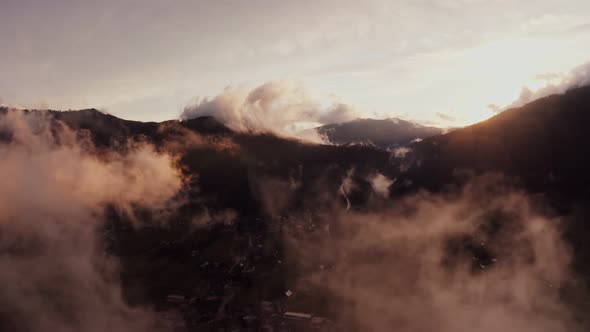 Panoramic View of a Picturesque Mountain Valley with a Village in a Lowland