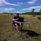 Graphic designer with laptop working with laptop and graphic tablet outdoor - VideoHive Item for Sale