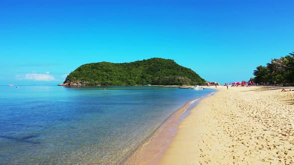 Tropical aerial tourism shot of a white paradise beach and blue water background in best quality