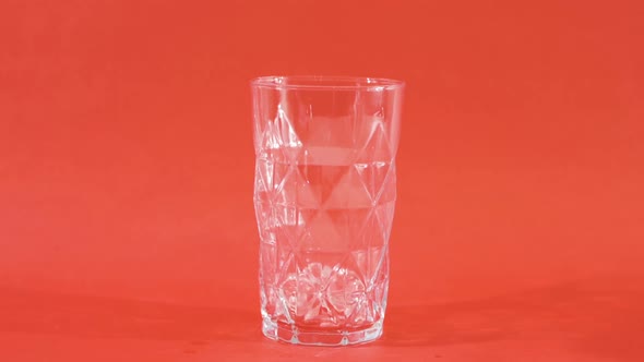 Cola glass with ice cubes.