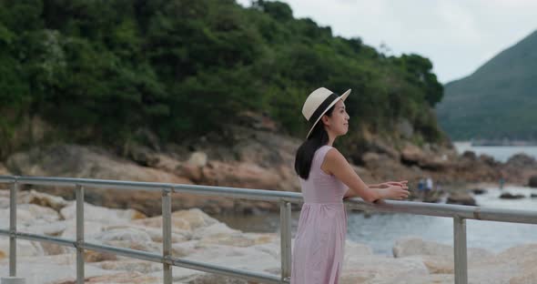 Woman look at sea at summer time