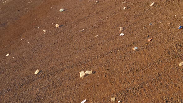 Close Up Plastic and Paper Garbage Moving By Wind Across Landfill Hawaii  USA