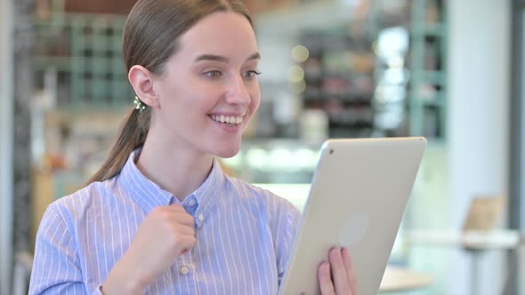 Portrait of Video Chat on Tablet By Young Businesswoman