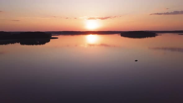 Orange Sunset Over Lake Drone Shot.