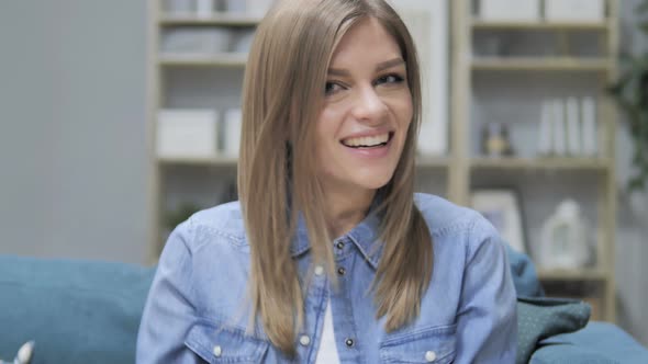 Young Girl Celebrating Success in Creative Office