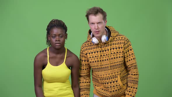 Young Multi-ethnic Couple Giving High-five Together