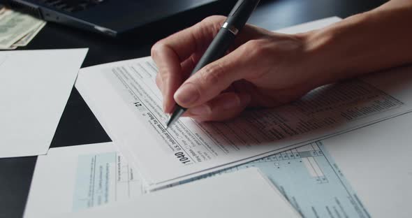 Woman Filling In The Tax Form