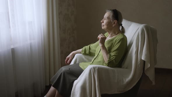 Old Woman Sitting on Armchair