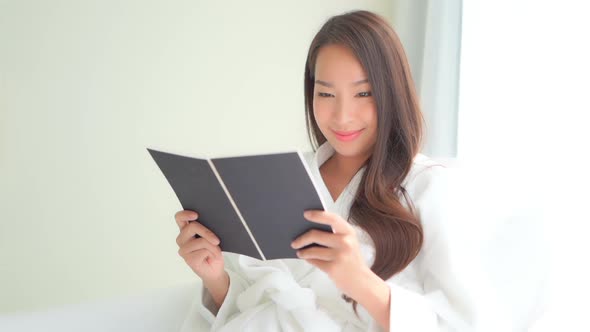 Young asian woman read book