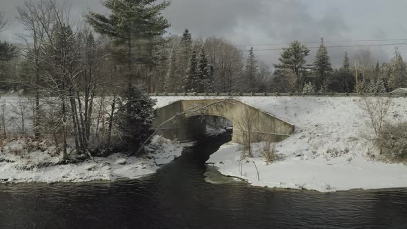 Aerial approach of bridge over tributary of Piscataquis river, Maine. USA