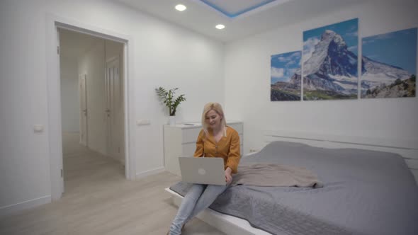 Focused Businesswoman Working on Laptop Computer in Home Office