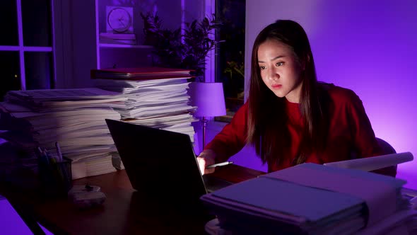 Workaholic people concept. Asian woman drinking coffee during overtime