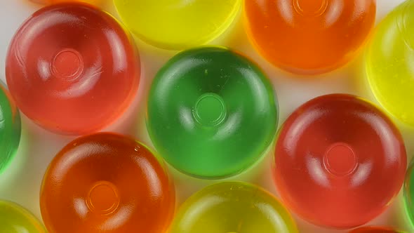 Colorful lollipops and different colored round candy